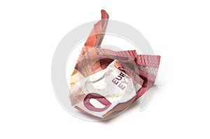 crumpled ten euros banknote on white background