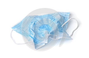 Crumpled used disposable medical face mask