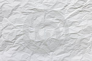 Crumpled used white wrapping paper texture background