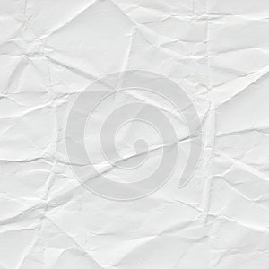 Crumpled white paper displaying an irregular pattern of folds and creases. The texture photo