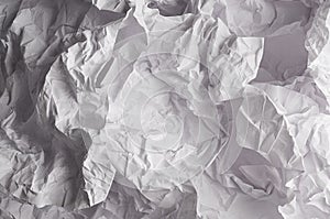 Crumpled wrinkled wavy grey paper texture, abstract polygon background.