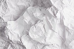 Crumpled wrinkled wavy grey paper texture, abstract polygon background.