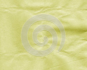 Crumpled yellow craft paper sheet