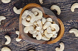 crunchy cashew nuts in a heart shaped bowl
