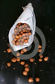 Crunchy chickpeas roasted with spices, street food snack photo