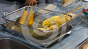 Crunchy chunky corn dog with butter and fried potatoes. Delicious korean style corn dogs