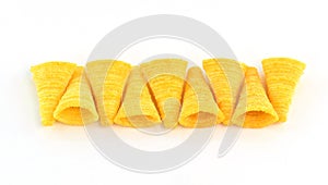 Crunchy corn snacks on a white background