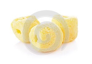 Crunchy corn snacks on a white background