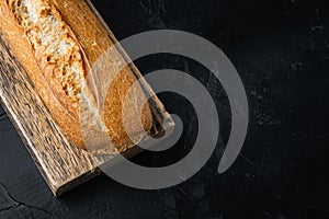 Crunchy french baguettes, on black background  with copy space for text