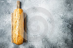 Crunchy french baguettes, on gray background, top view flat lay  with copy space for text