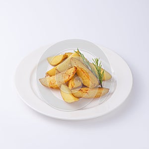 Crunchy fried potato slices with fresh rosemary isolated on white background