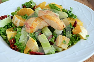 Crunchy green salad with pecans ,sweet lime and fish photo