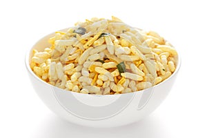 Crunchy Murmura in a white ceramic bowl  made with Puffed Rice and Curry leaves.