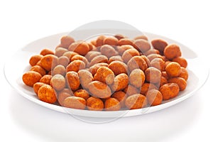 Crunchy Peanut in a white ceramic square plate, made with besan coated peanuts.