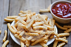 Crunchy prawn crackers or shrimp crisp traditional snack - prawn crackers stick on plate and ketchup