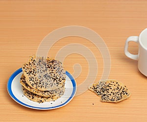 Crunchy rice cracker strew with black and white sesame