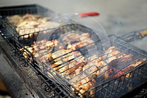 Crunchy slices of chicken meat on the grill,