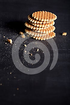 Crunchy waffles in a stack on blackboard