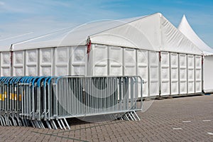 Crush barriers near a big marquee