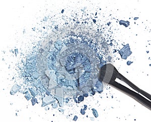 Crushed blue eyeshadow with makeup brush