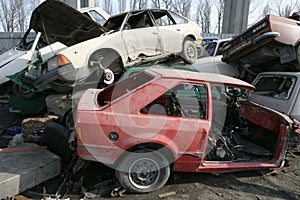 Crushed cars in junkyard