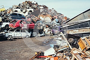 Crushed cars stacked up for recycling.