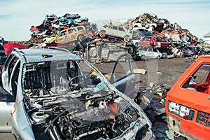 Crushed cars stacked up for recycling.