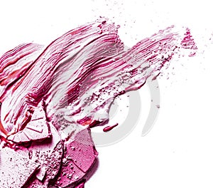 Crushed eyeshadow, powder and liquid foundation close-up isolated on white background