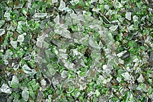 Crushed small pieces of glass are gathered for recycling in a machine in a recycling facility. photo