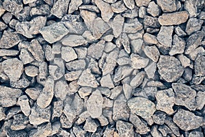 Crushed gray quartz close-up. The industrial fraction is used in the production of building materials, water treatment
