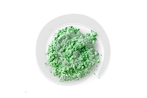 Crushed green eye shadow isolated on white background