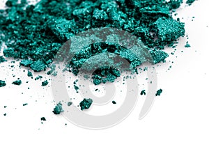 Crushed green eye shadow on white background