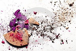 crushed make-up products - beauty and cosmetics styled concept