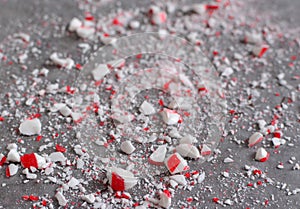Crushed peppermint candy cane bits sprinkled on wax paper