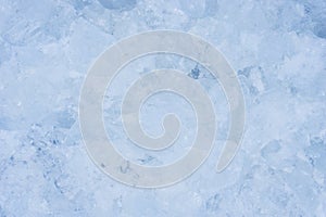 Crushed pieces of ice with snow background texture