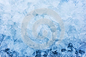 Crushed pieces of ice with snow background texture