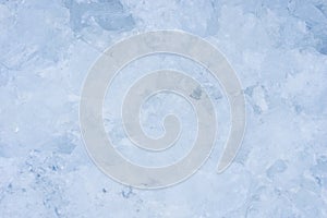 Crushed pieces of ice with snow background texture