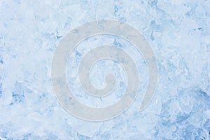 Crushed pieces of ice with snow background texture