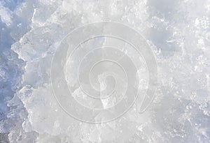 Crushed pieces of ice with snow background texture