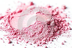 Crushed Pink Blush Makeup Powder Scatter on a White Background