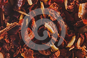 Crushed red hot peppers.Suns mixed with peel close-up background. Macro shooting