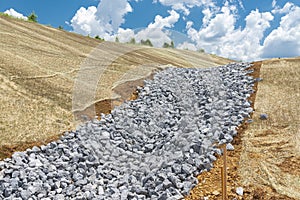 Crushed Rock Base For New Drainage Ditch photo