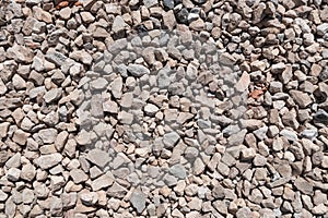 Crushed rock close up. Small rocks ground. Small crushed stone, construction material rock, gravel texture
