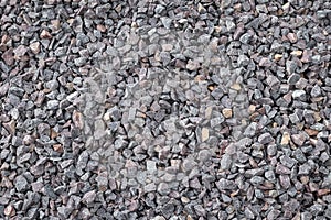 Crushed rock close up. Stone road building material gravel texture, background