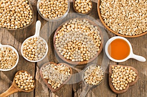 Crushed soybeans - Glycine max. Wooden background