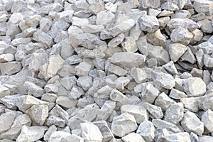 Crushed stone, building material texture, full frame. Bulk material for the construction of roads, roadways, pipe laying