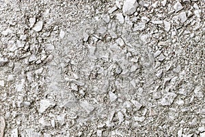 Crushed stone embedded in cement mortar, rough surface, background