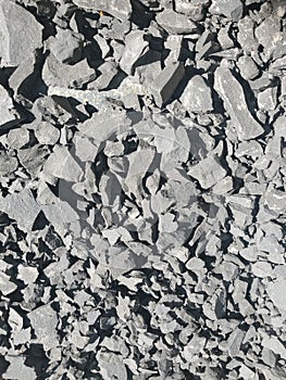 Crushed stone grey rock texture background gravel