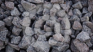 Crushed stone mounds.Grey crushed stones in close up,Versatile building material for horticulture,landscape gardening or road