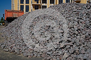 Crushed stone mounds.Grey crushed stones in close up,Versatile building material for horticulture,landscape gardening or road